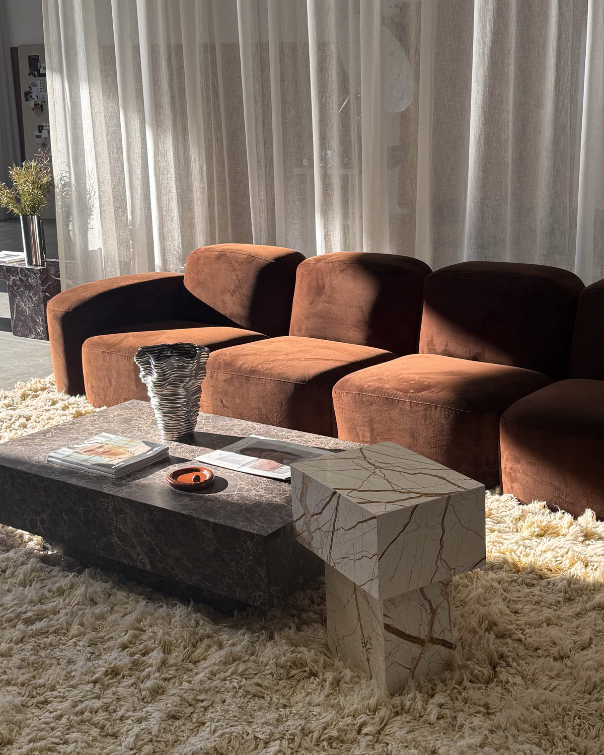 Modern living room featuring Fleur Studios marble pieces