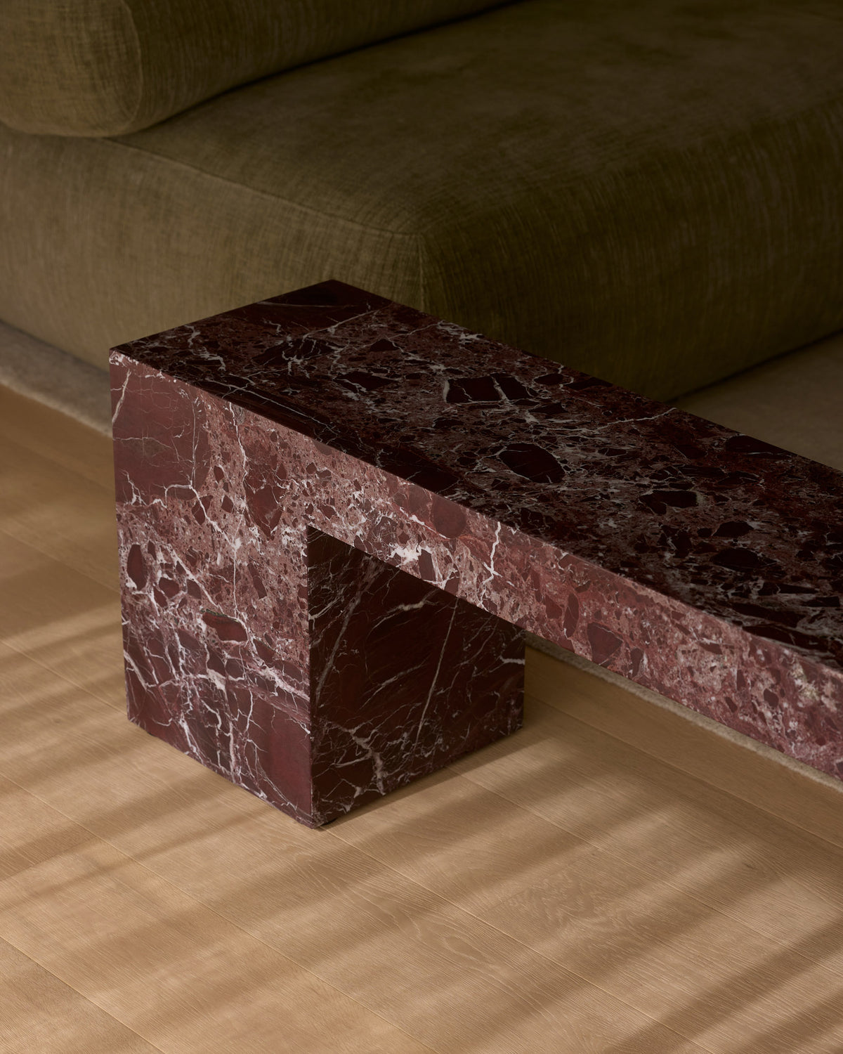 Low marble bench seat in rosa levanto