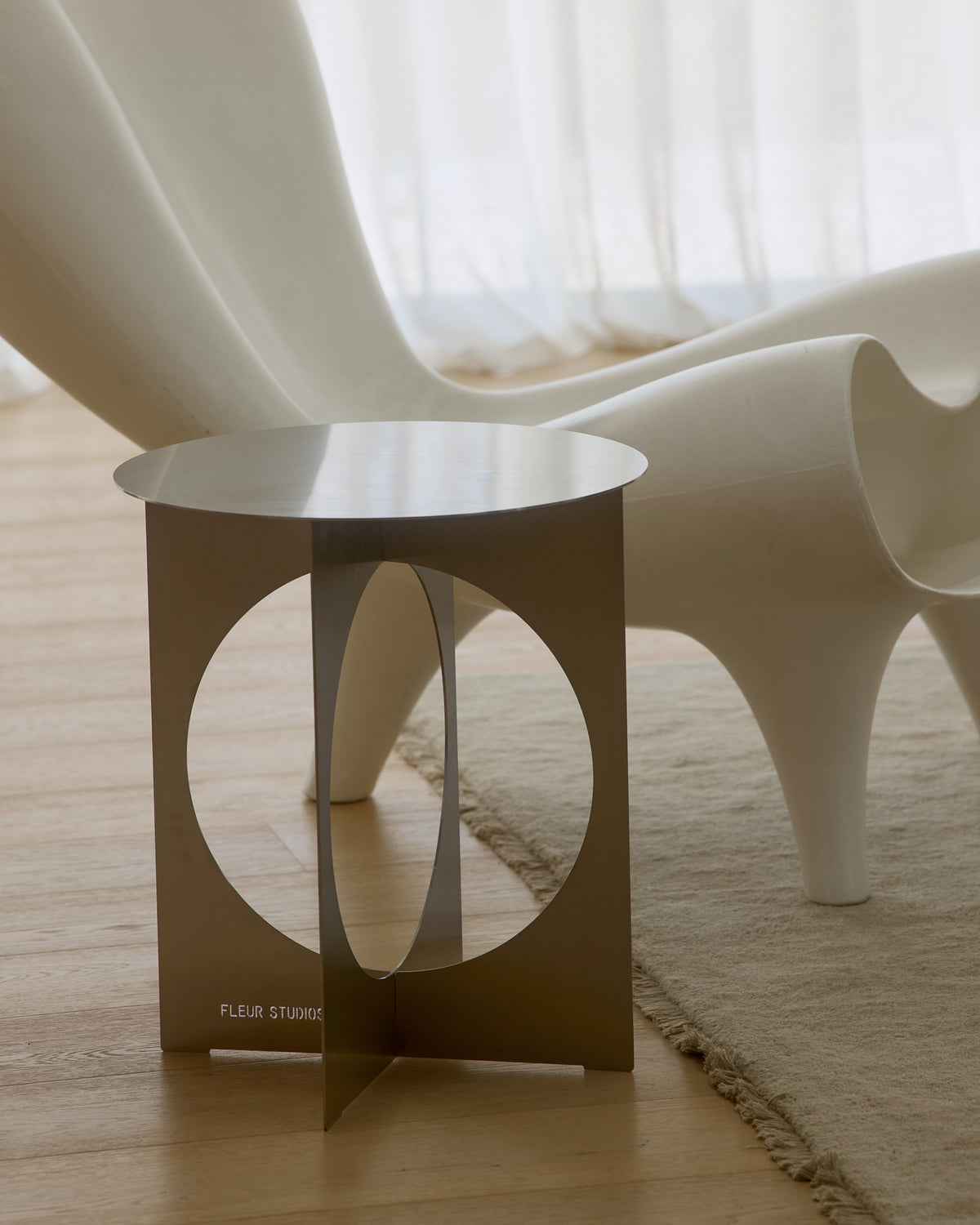 Modern stainless steel side table.