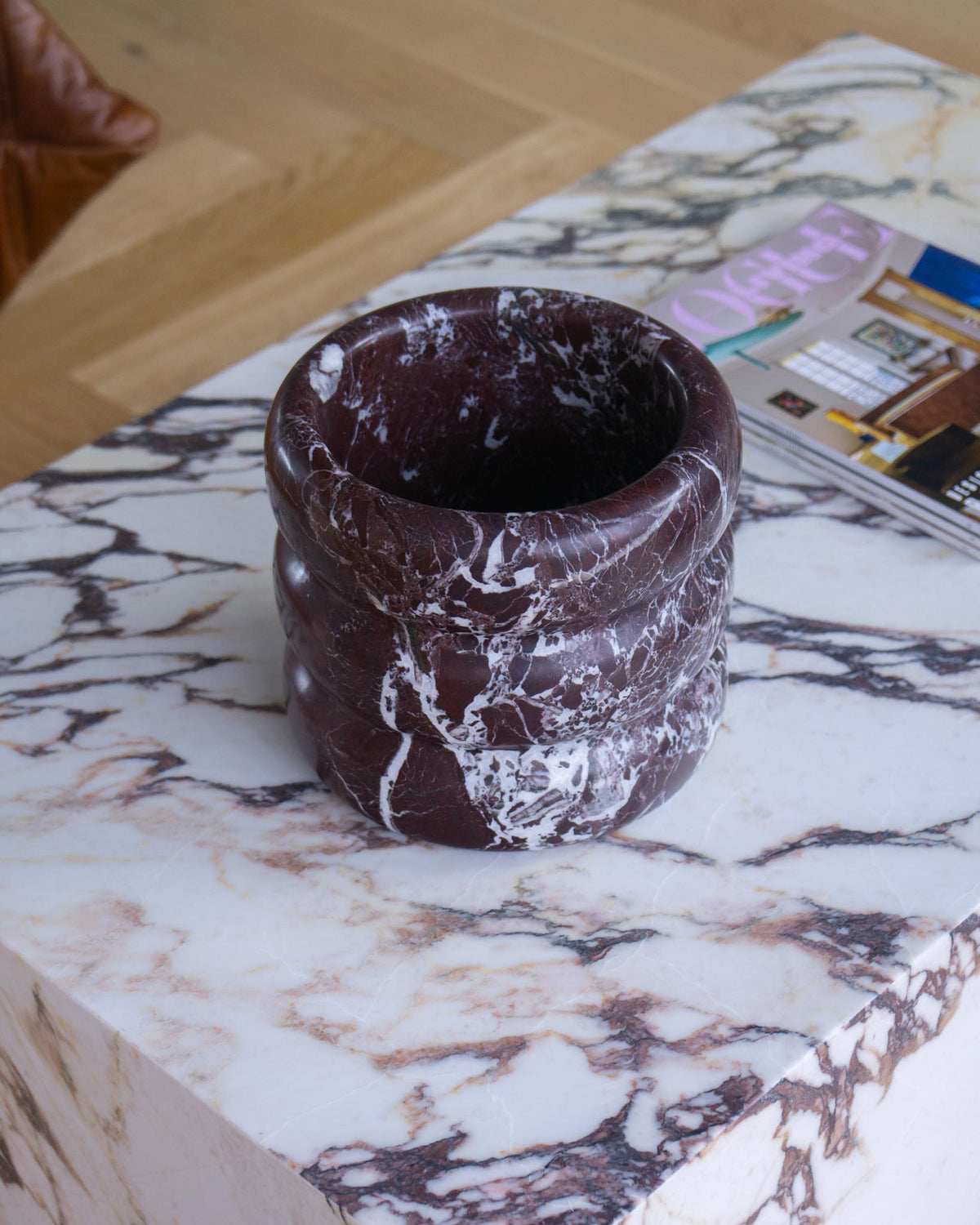 Marble champagne cooler styled on a coffee table