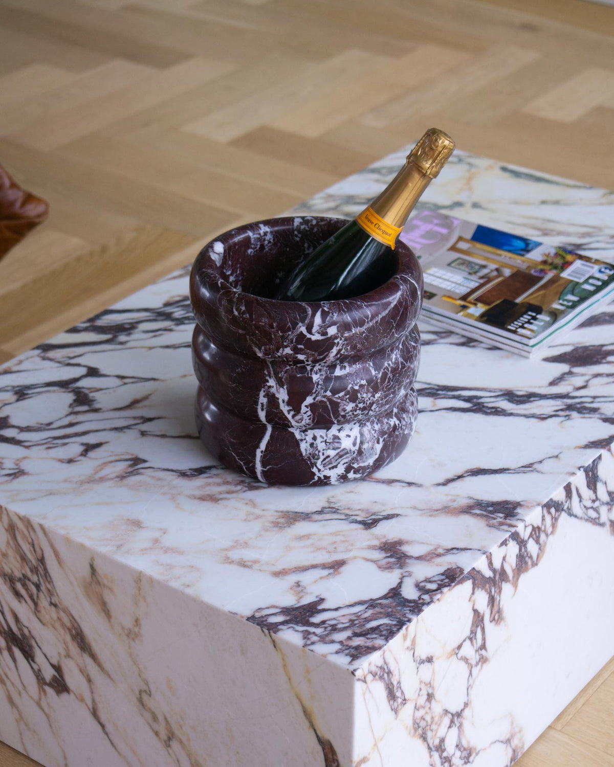 Marble champagne cooler styled on a coffee table