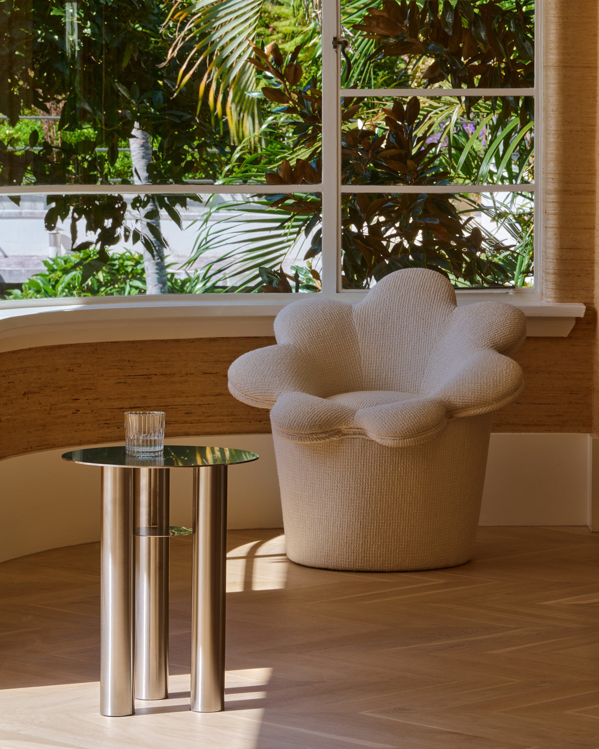 Stainless steel side table styled in a home.