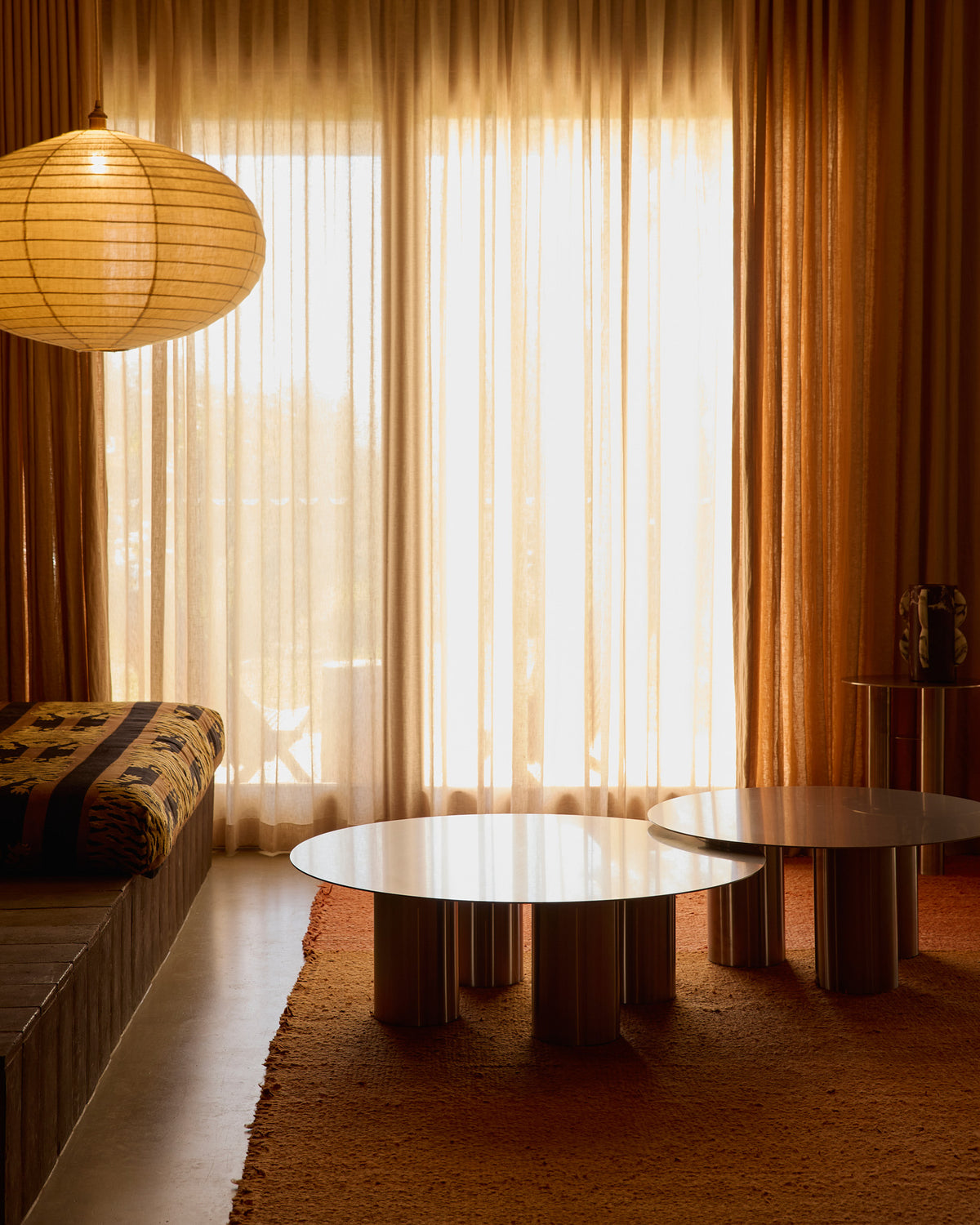 Stainless steel coffee tables styled in a living room.