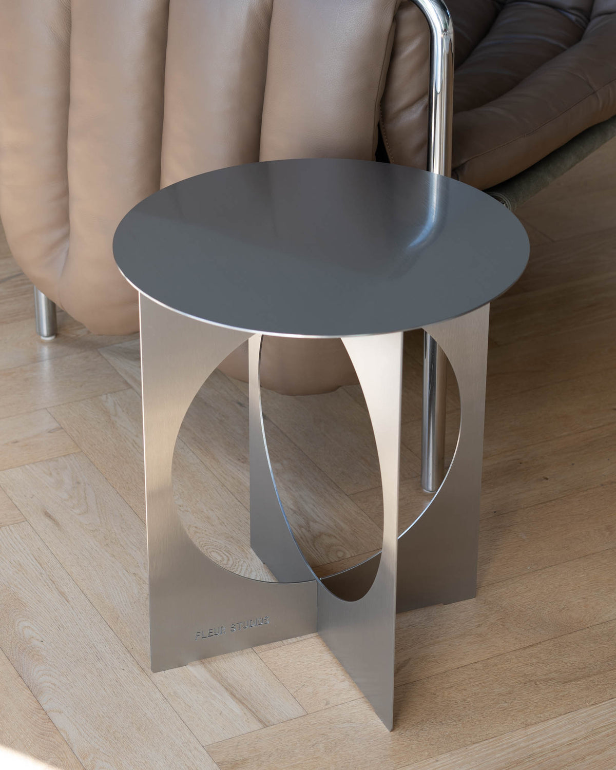 Modern stainless steel side table.