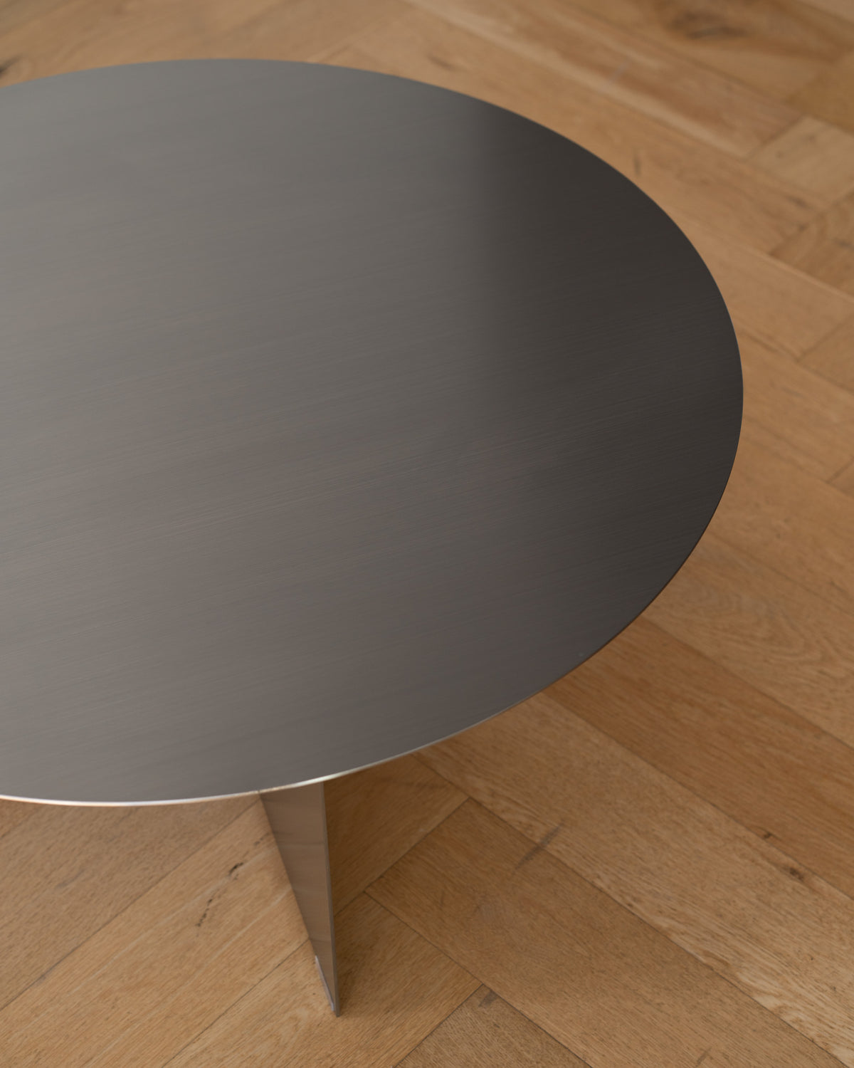 Round stainless steel coffee table.