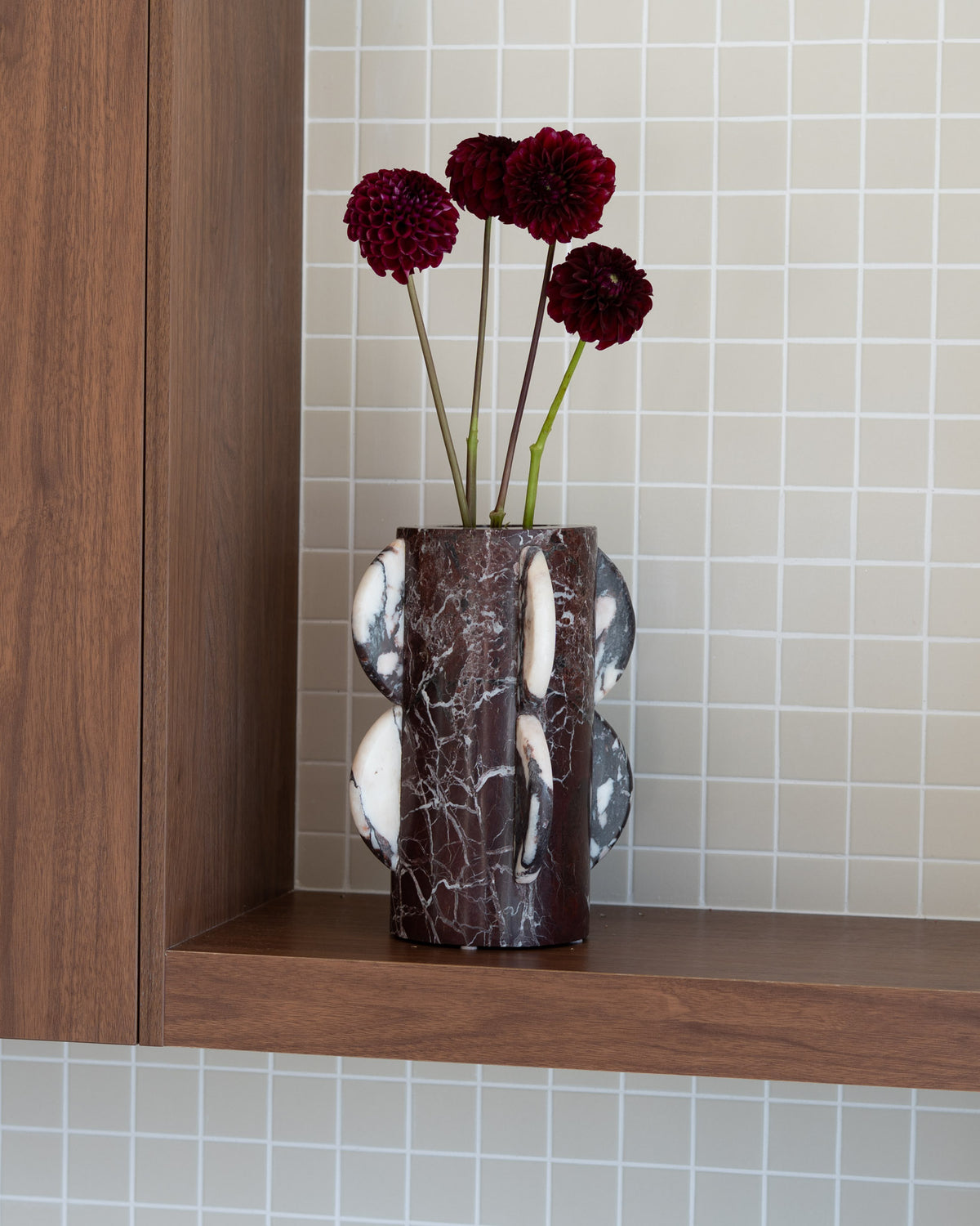 A cylindrical marble vase