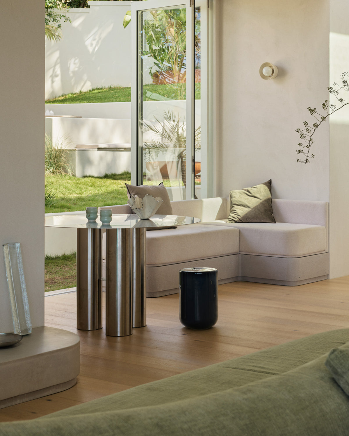 Stainless steel dining table styled in a home.
