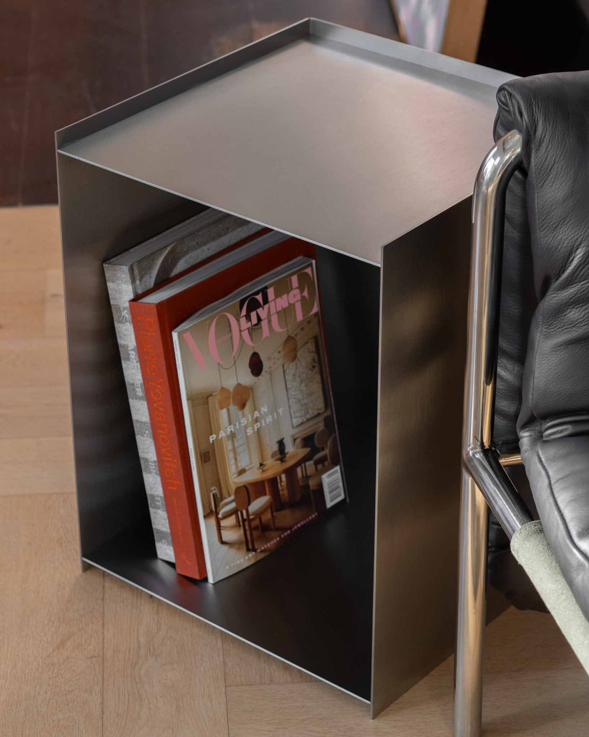 Stainless steel bedside table.