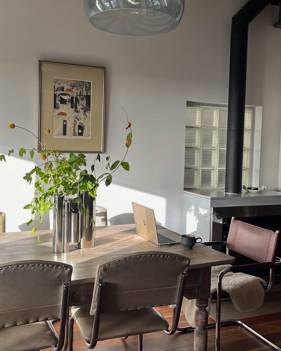 Dining room styled with stainless steel vase
