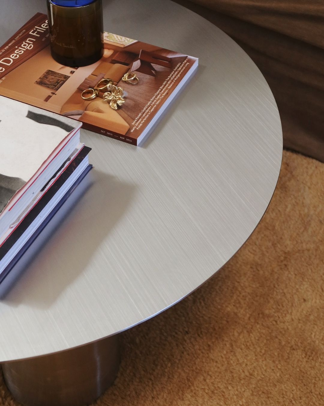 Round stainless steel coffee table styled