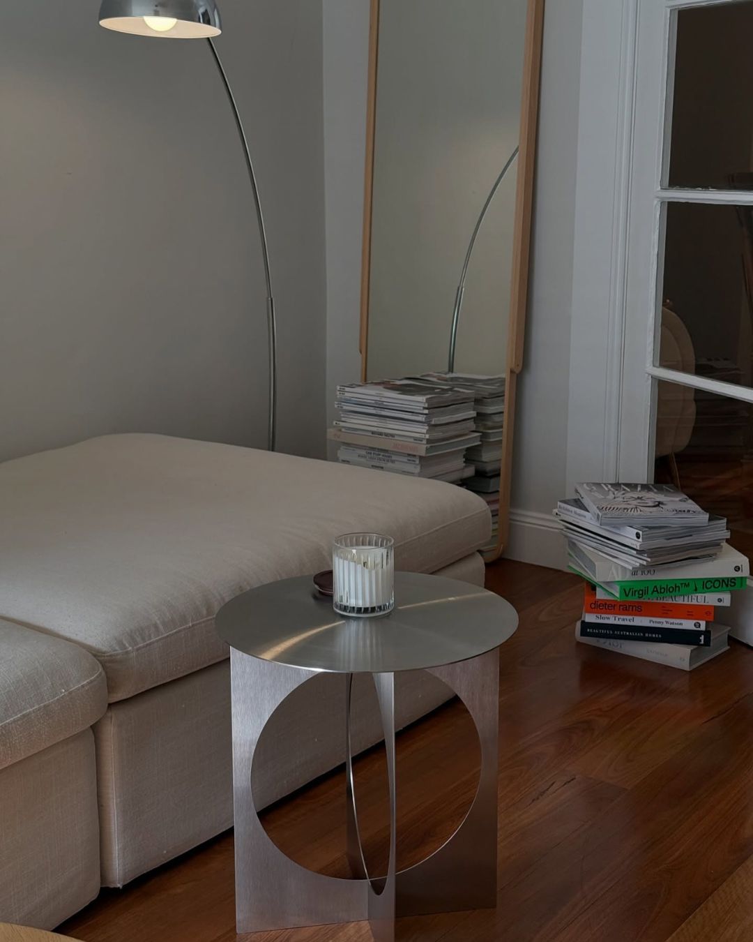 Living room styled with a stainless steel side table