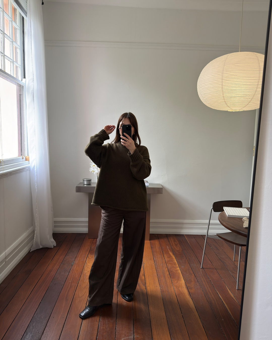Mirror selfie featuring a living room
