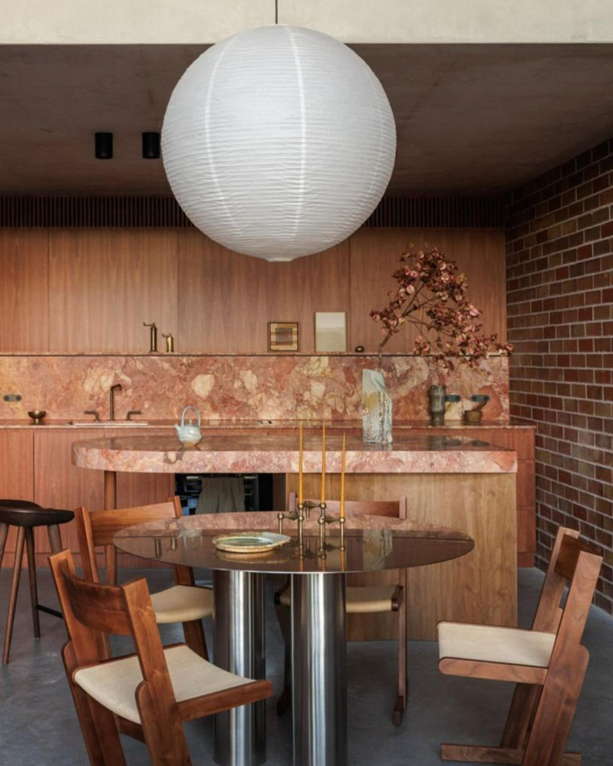 Modern dining room with a stainless steel dining table