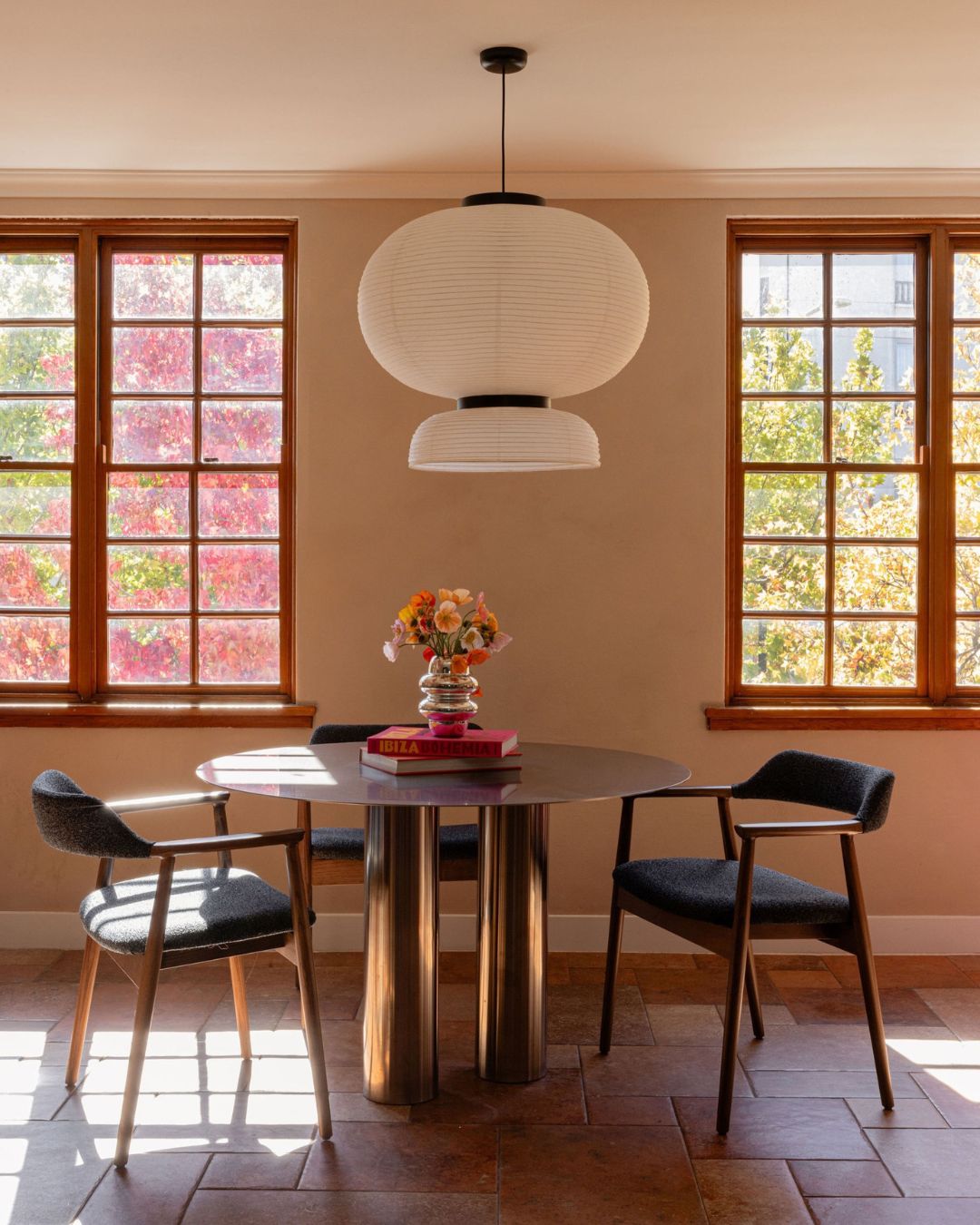 Modern dining room with a stainless steel dining table