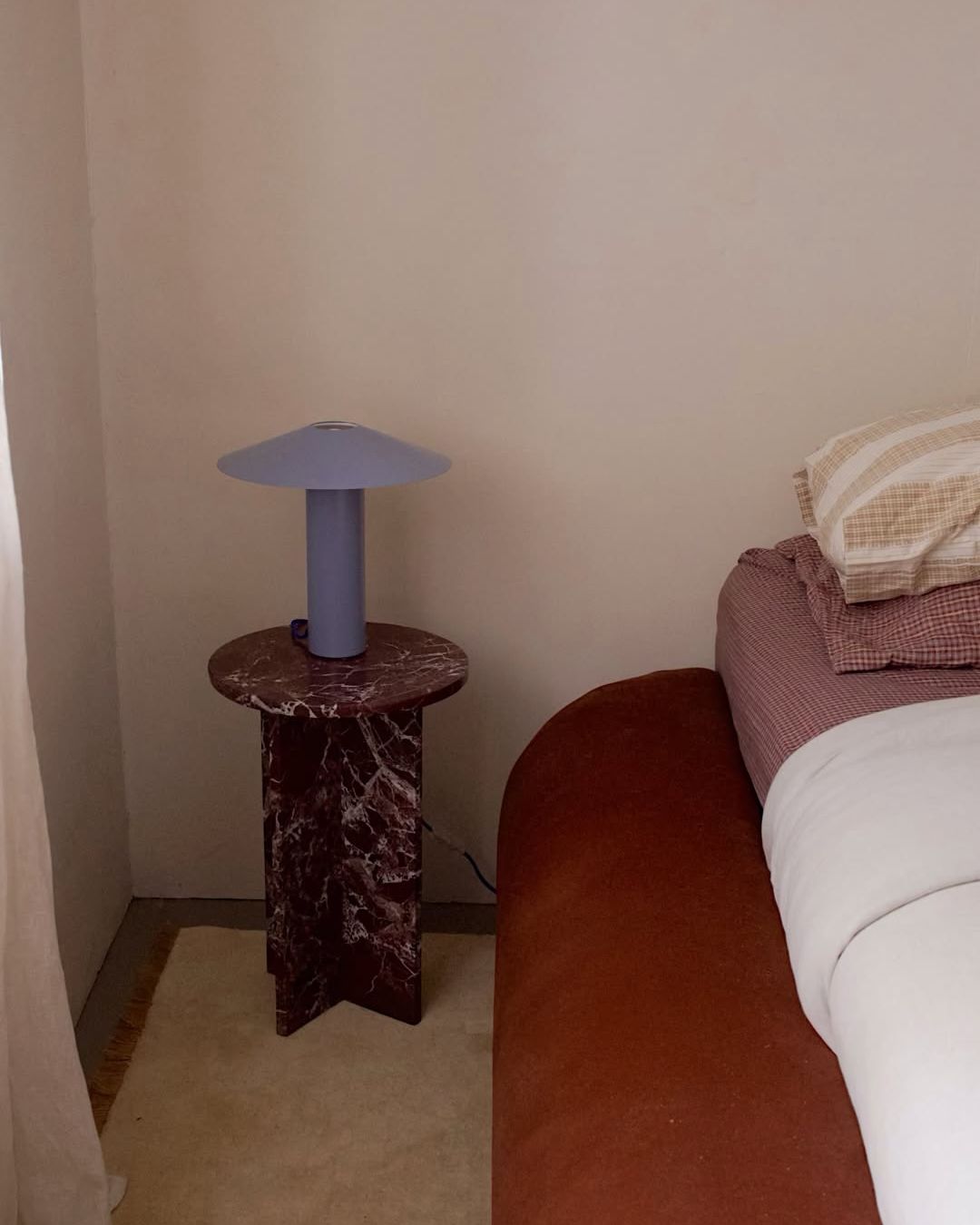 Rosa levanto marble side table in a bedroom