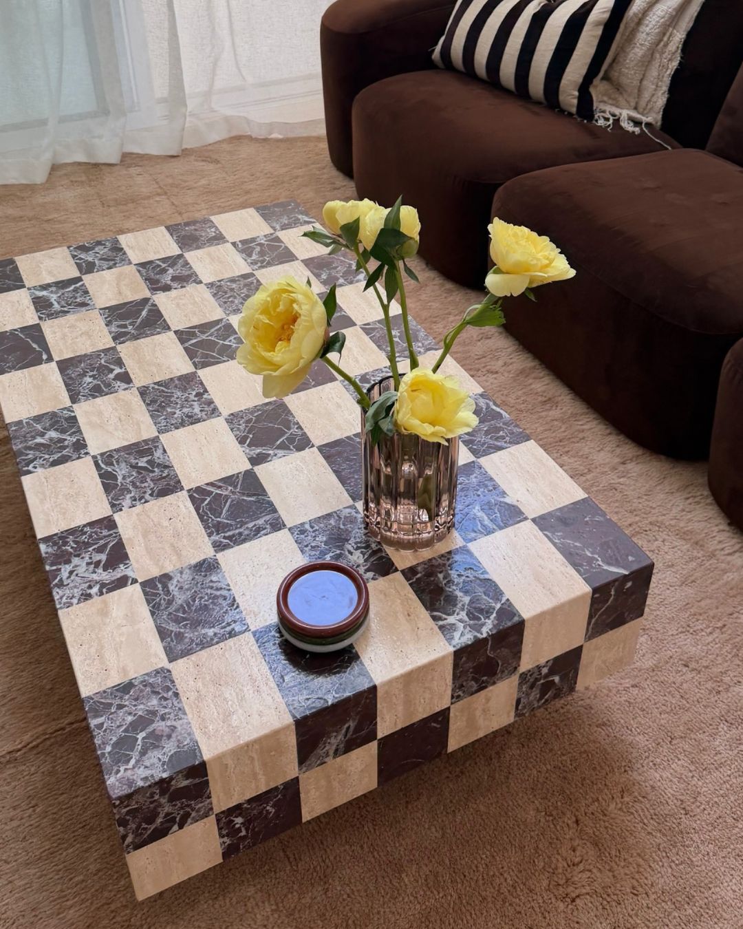 Living room featuring a checkered marble coffee table