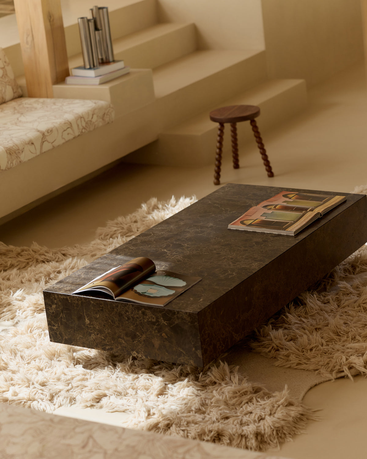 Chocolate marble coffee table styled in a living room
