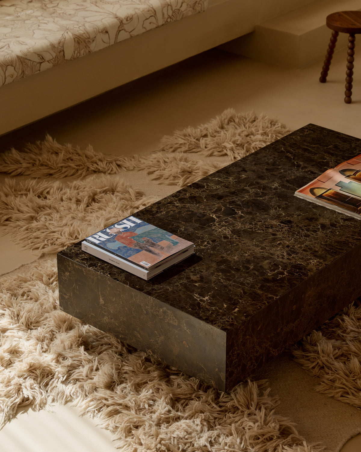 Chocolate marble coffee table styled in a living room