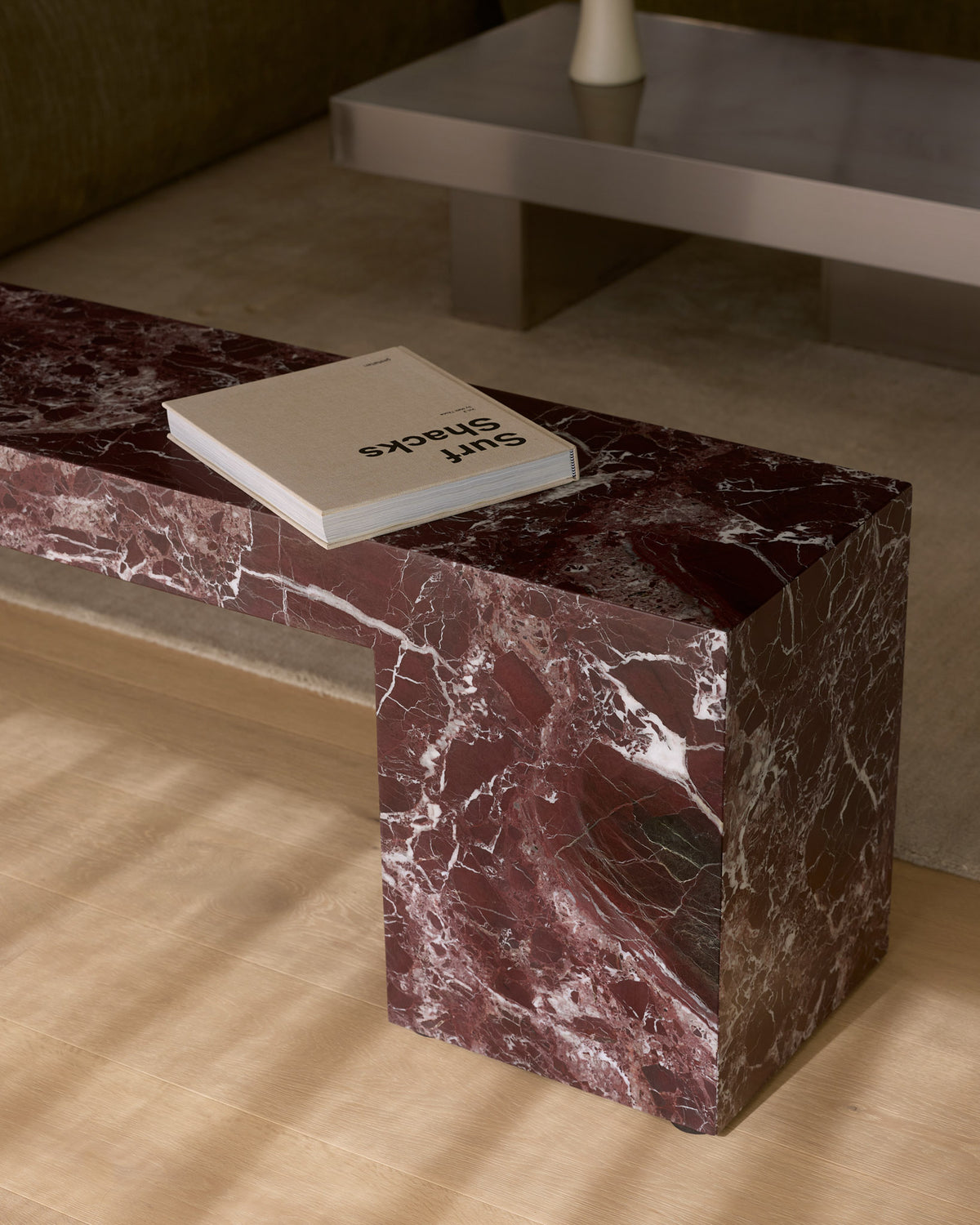Low marble bench seat in rosa levanto