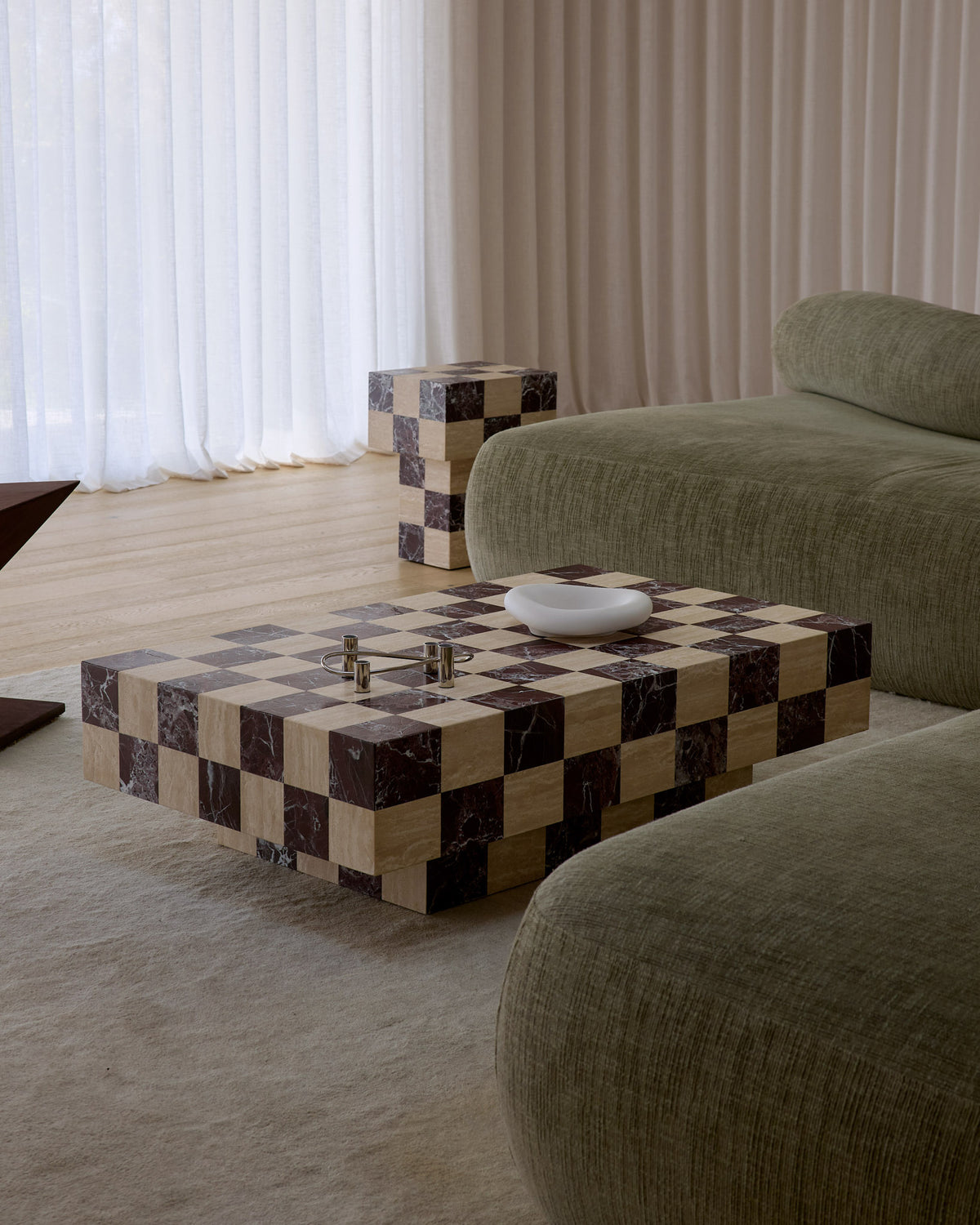 A modern checkered coffee table styled in a living room