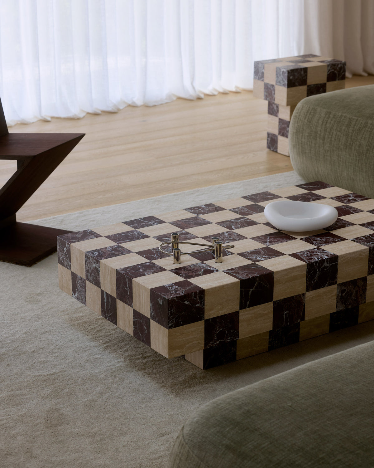 A modern checkered coffee table styled in a living room