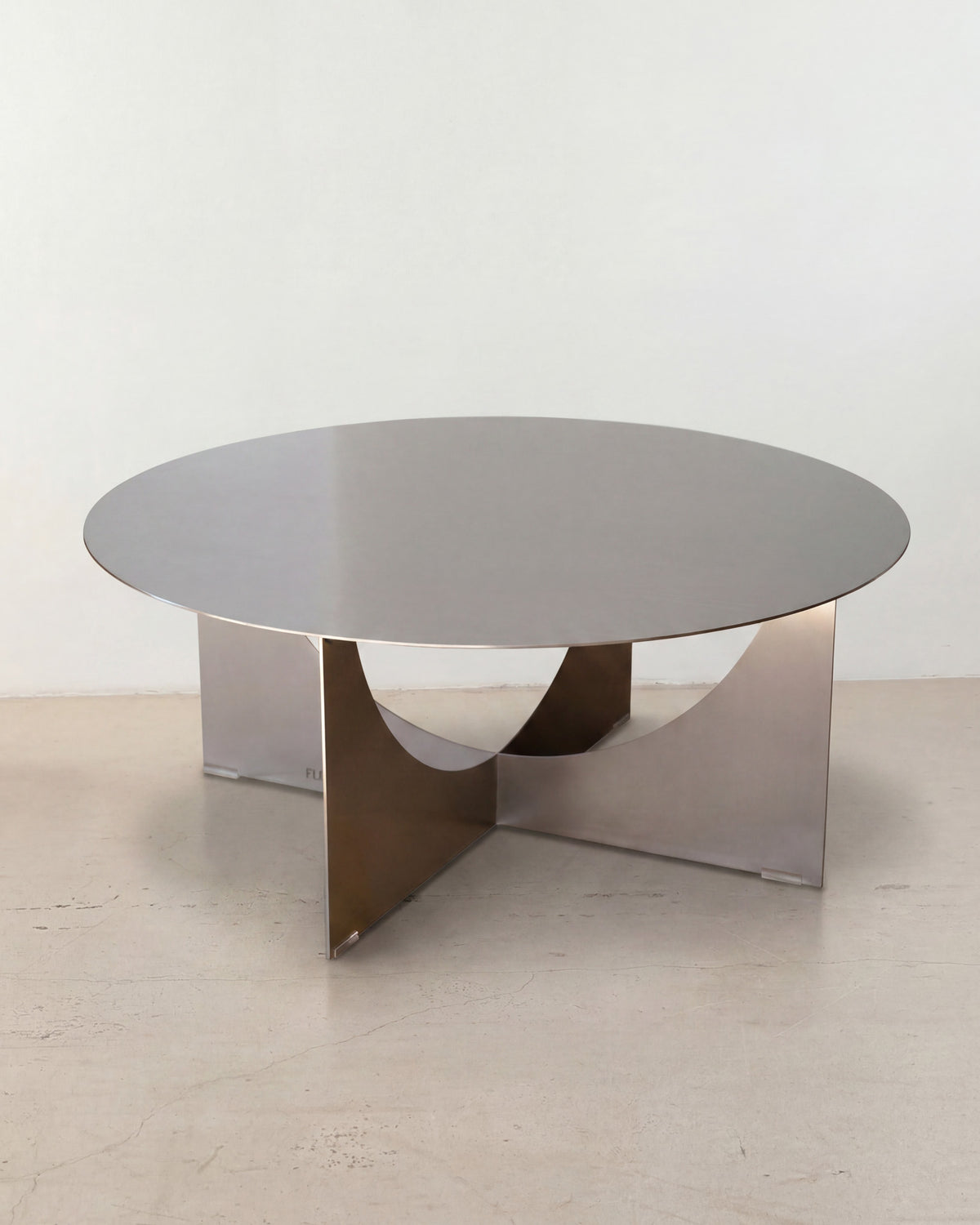 Round stainless steel coffee table.