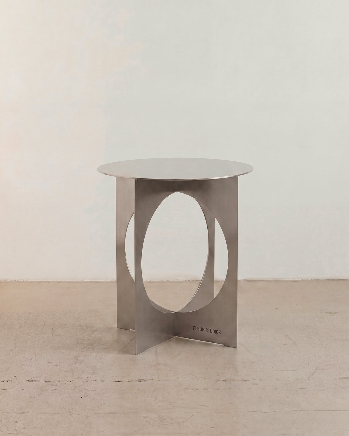 Modern stainless steel side table.
