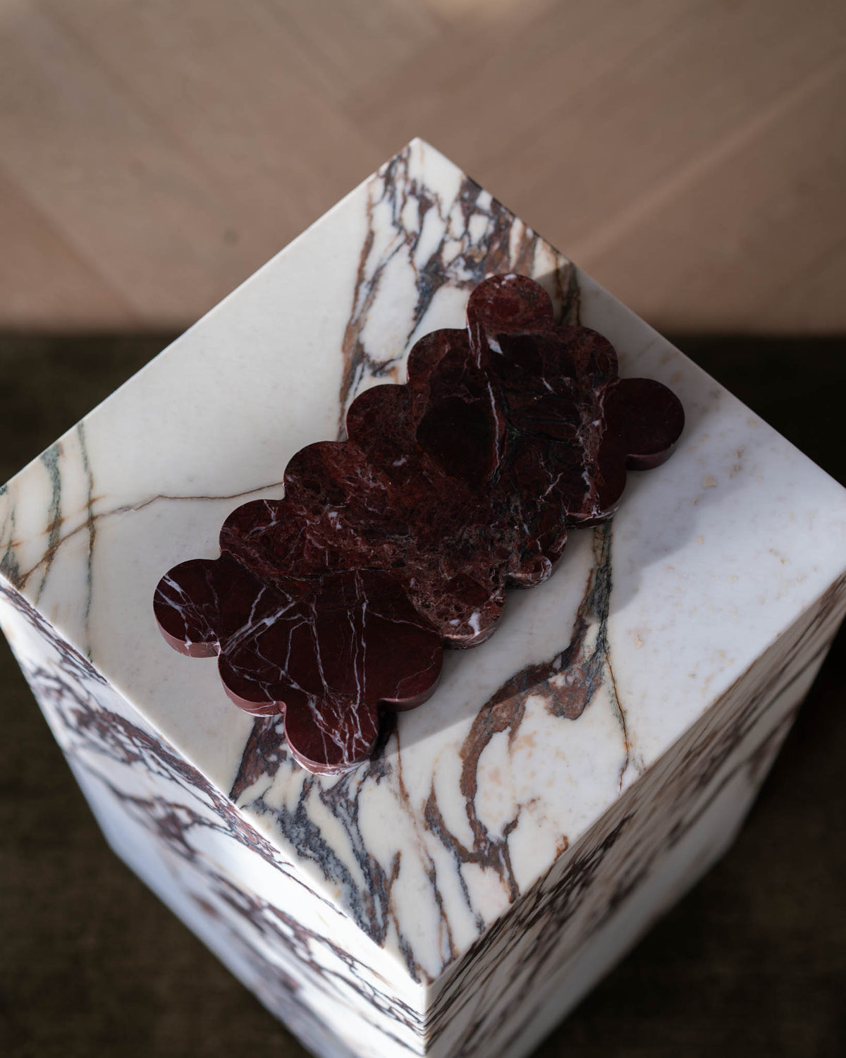 Decorative marble plate atop a plinth