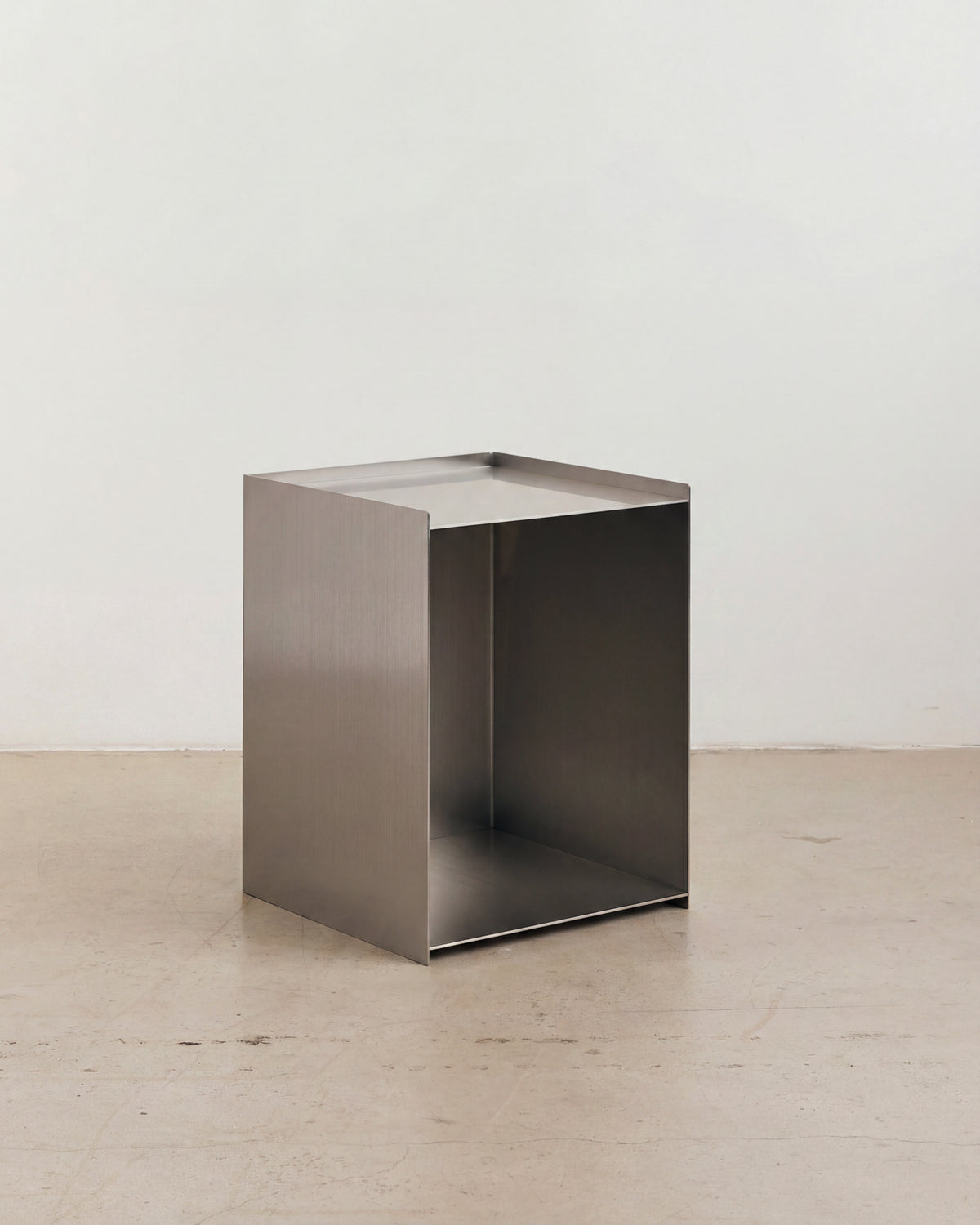 Stainless steel bedside table.