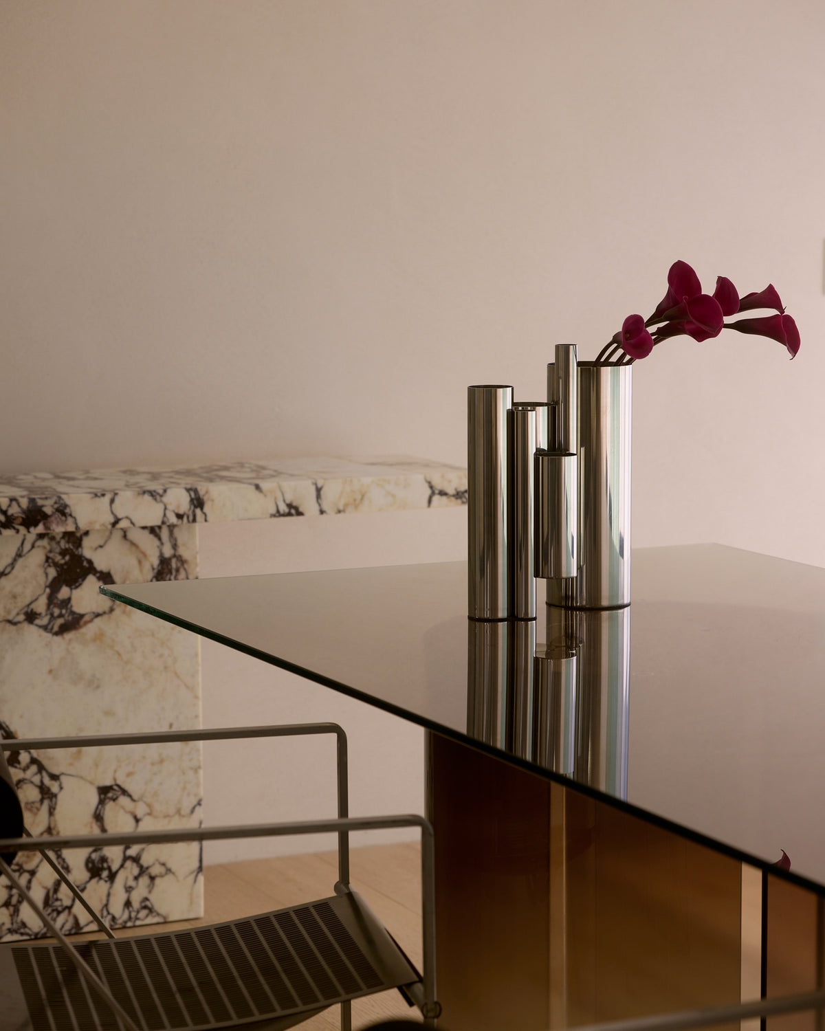 Stainless steel vase styled on a dining table