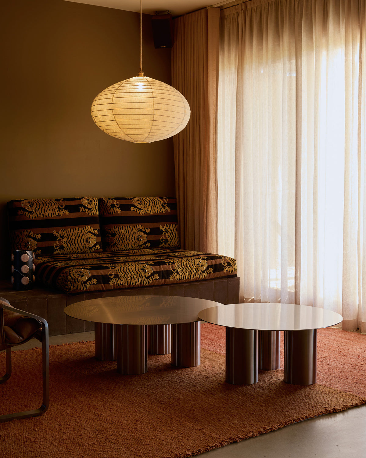 Stainless steel coffee tables styled in a living room.