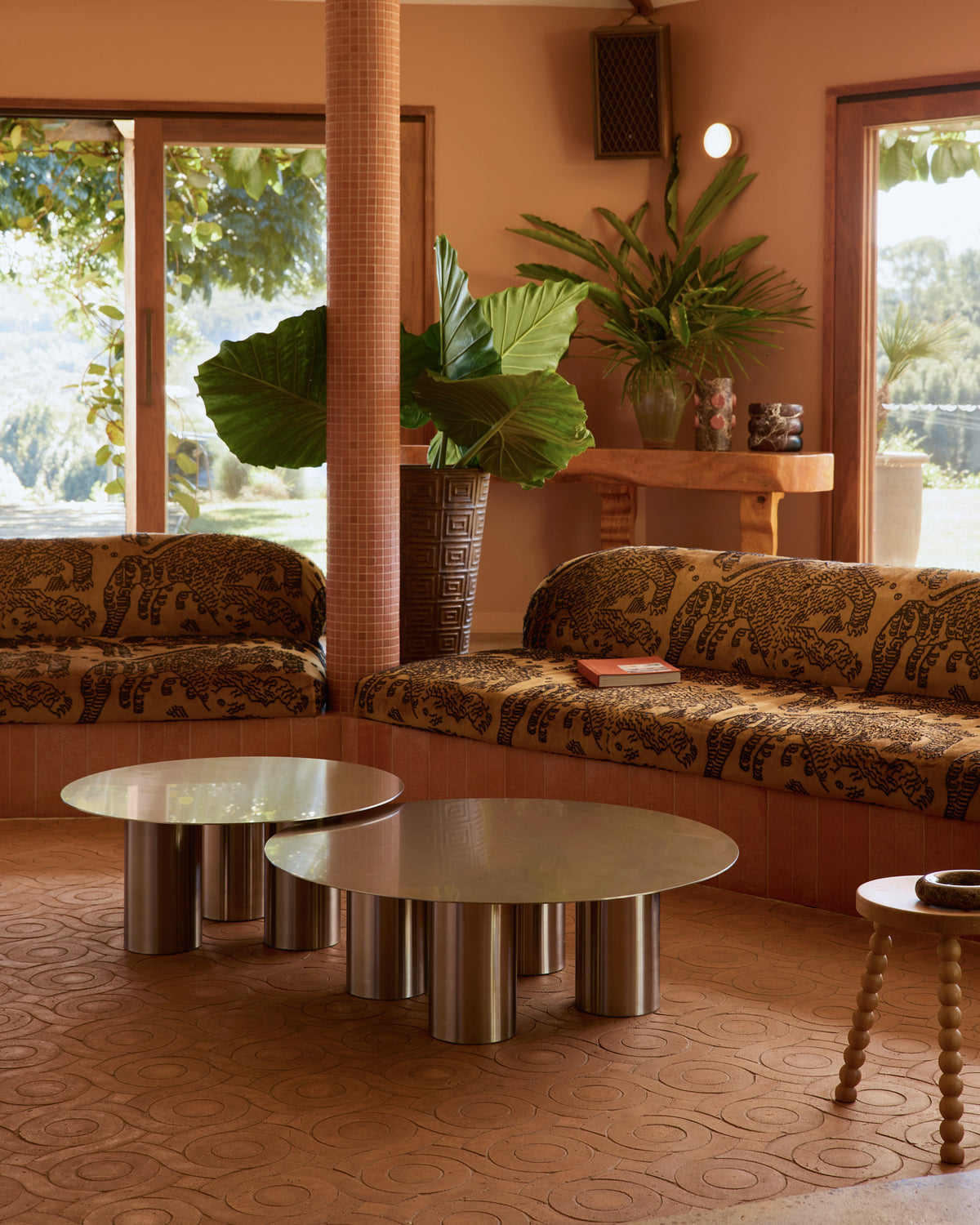 Stainless steel coffee table styled in a living room.