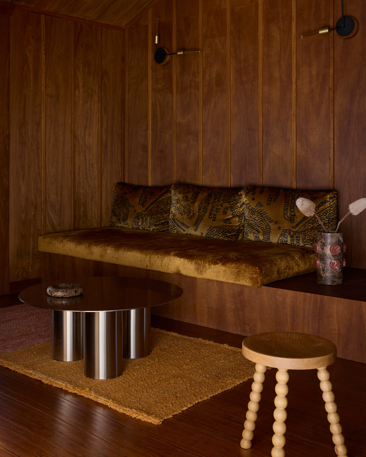 Stainless steel coffee table styled in a living room.