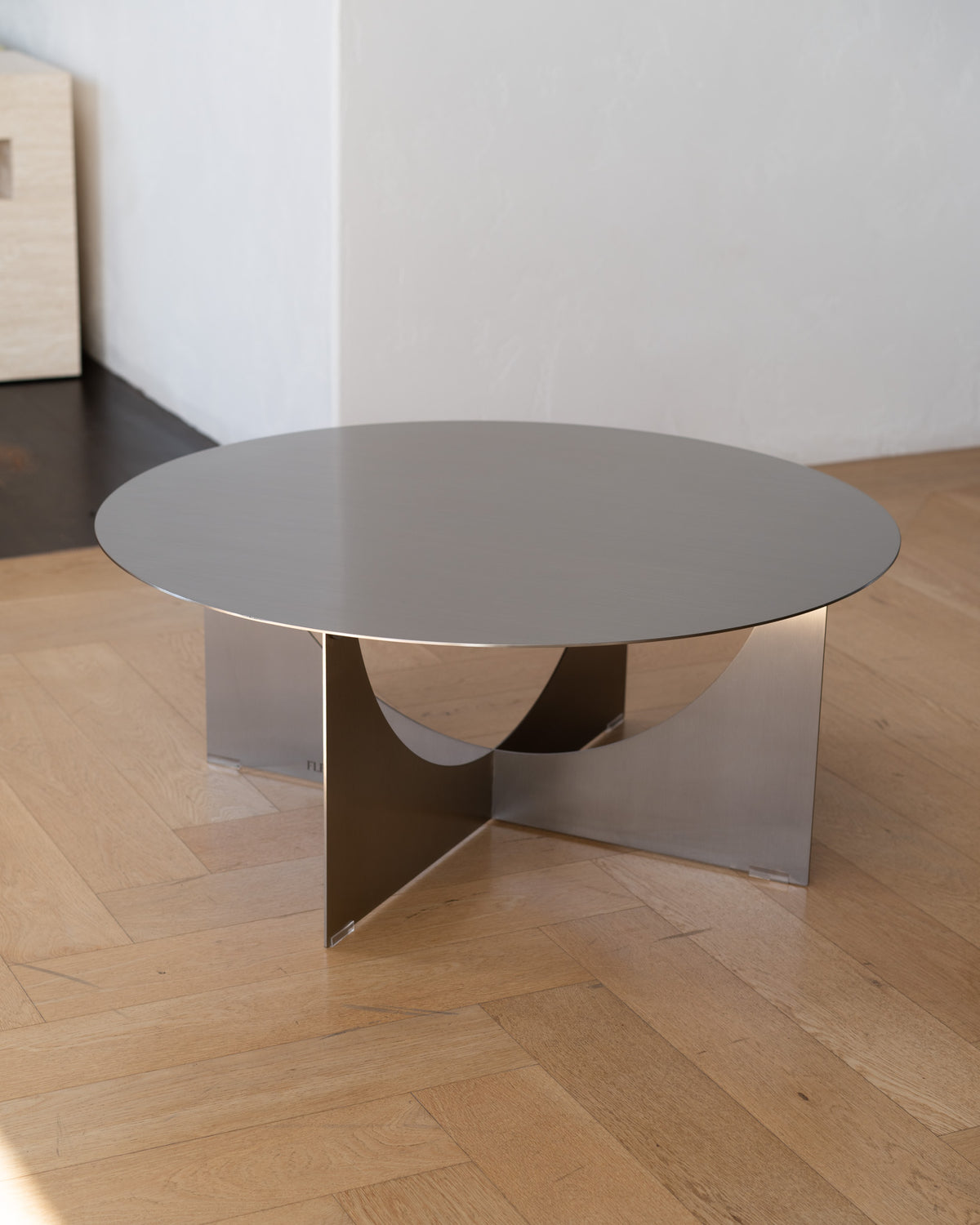 Round stainless steel coffee table.