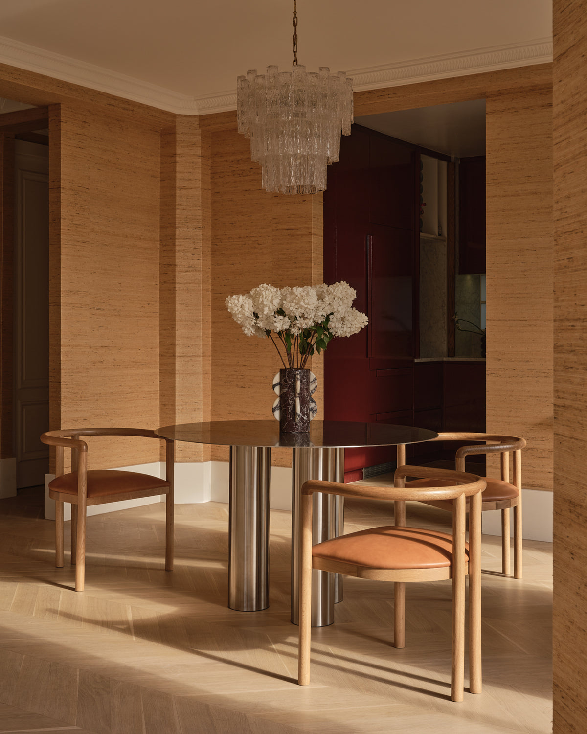 Stainless steel dining table styled in a home.