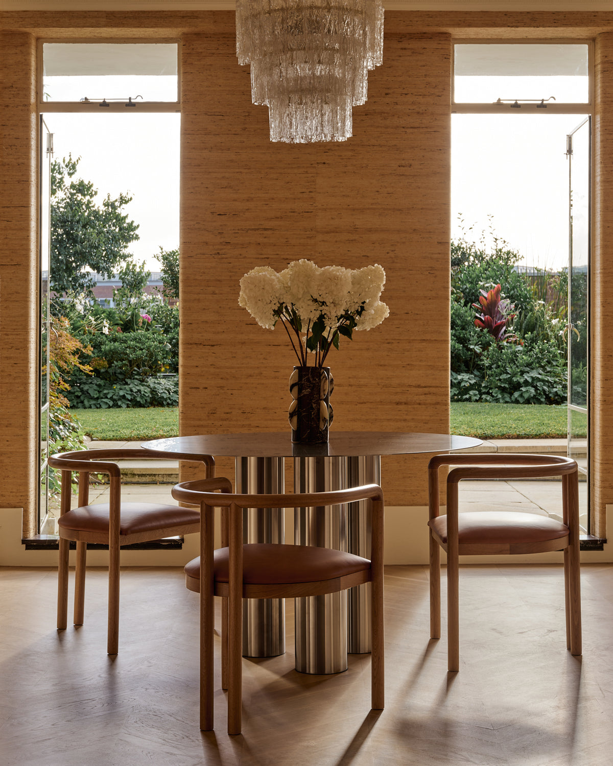 Stainless steel dining table styled in a home.