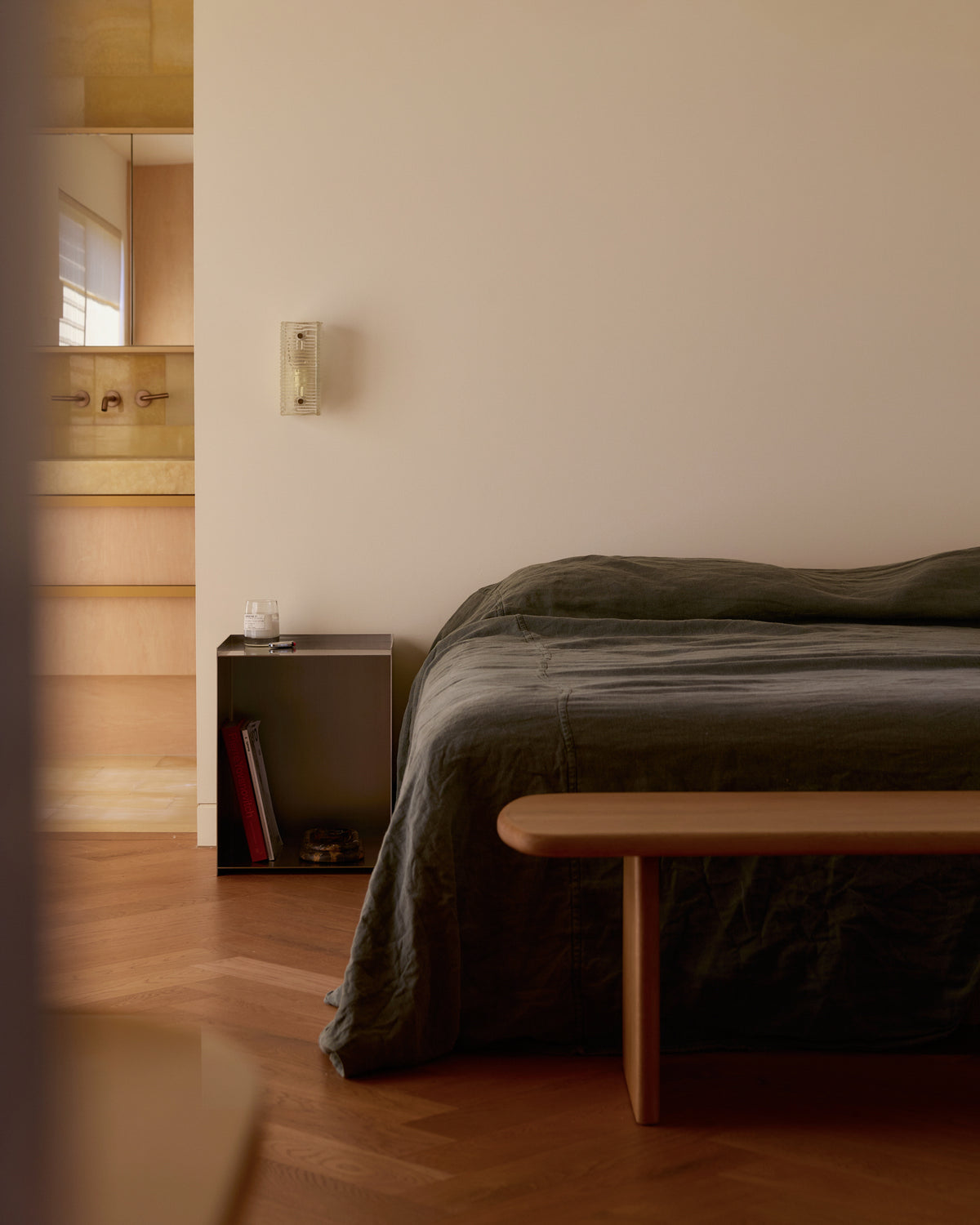 Stainless steel bedside table styled in a bedroom.