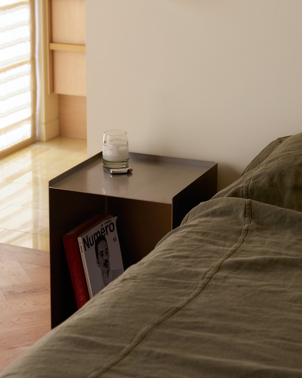 Stainless steel bedside table.