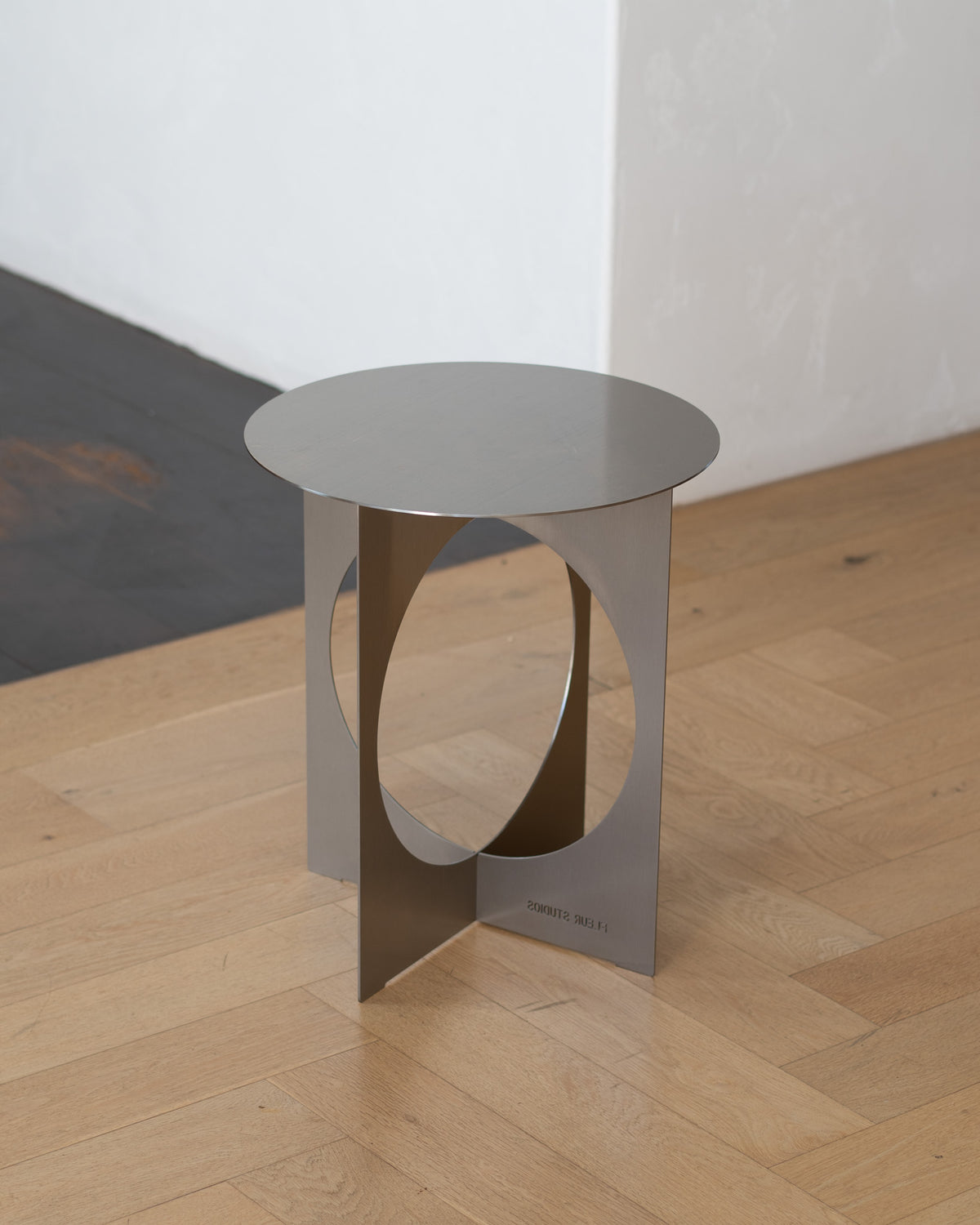 Modern stainless steel side table.