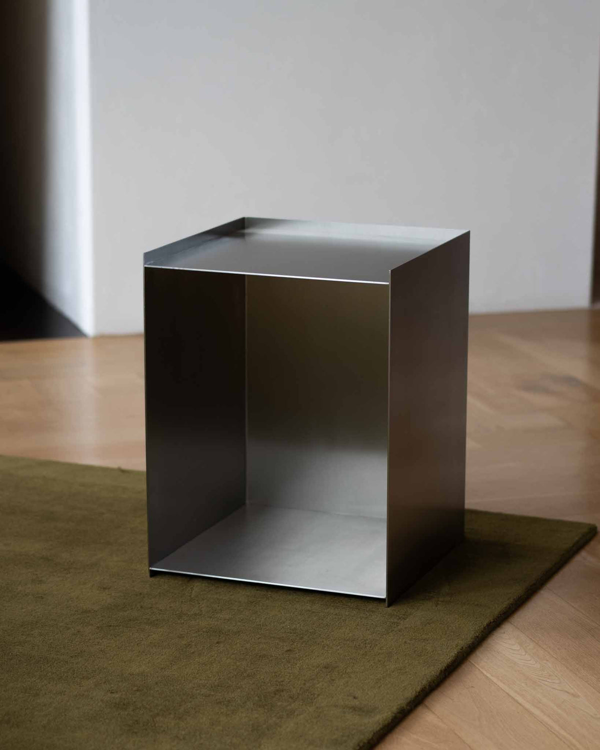 Stainless steel bedside table.