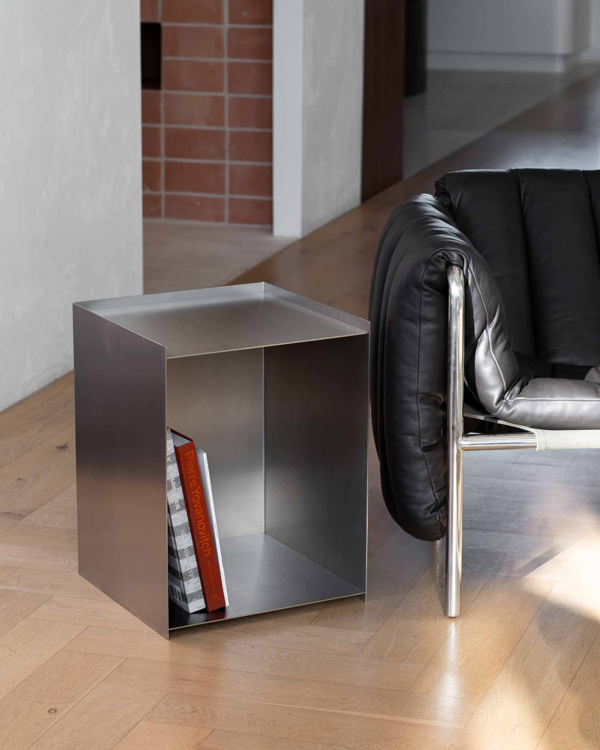 Stainless steel bedside table.