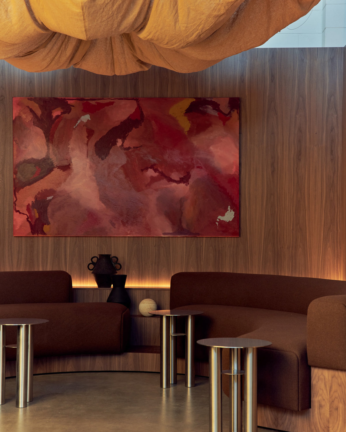 Stainless steel side tables styled in a lobby