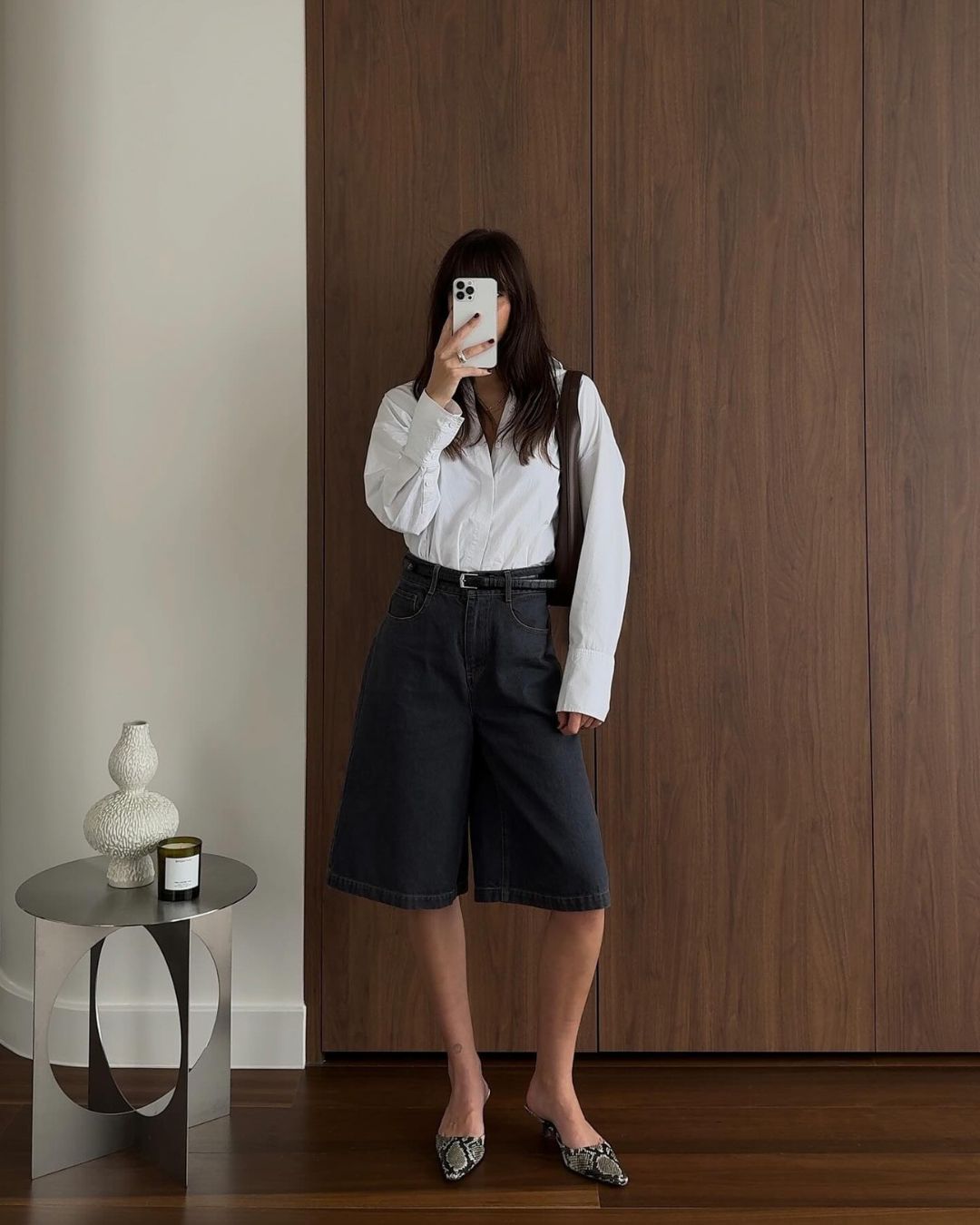 Mirror selfie featuring a stainless steel side table