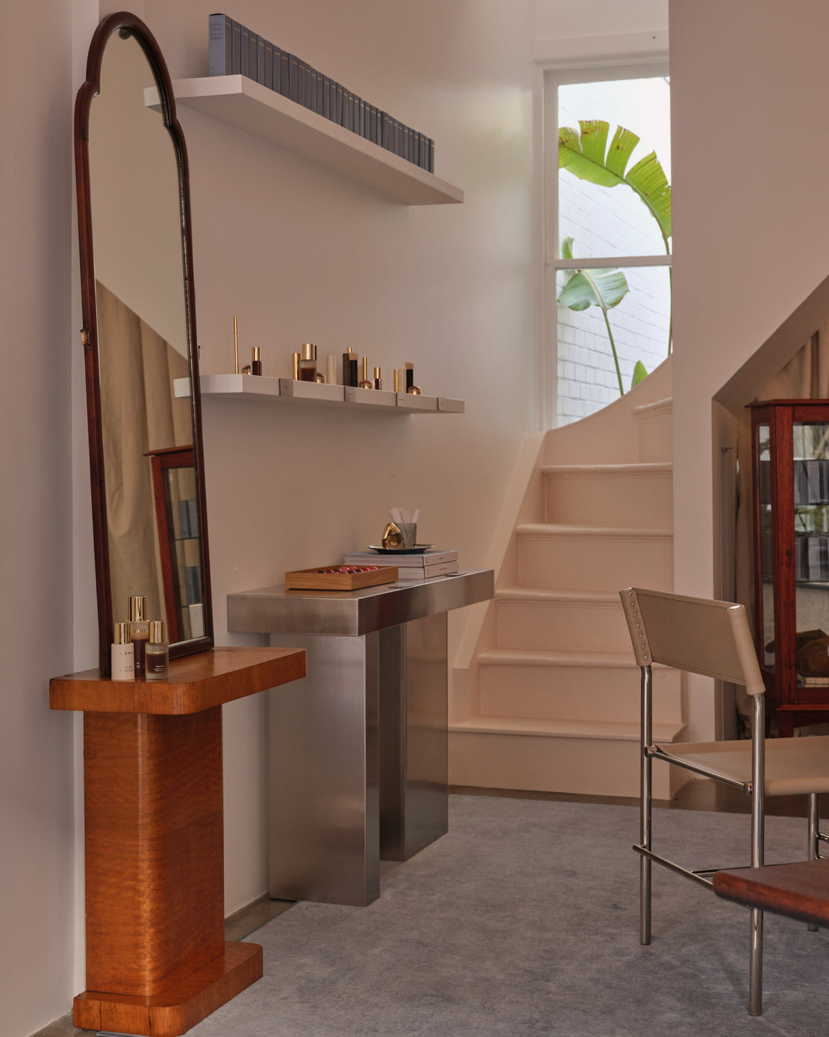 Stainless steel console table styled in a living room