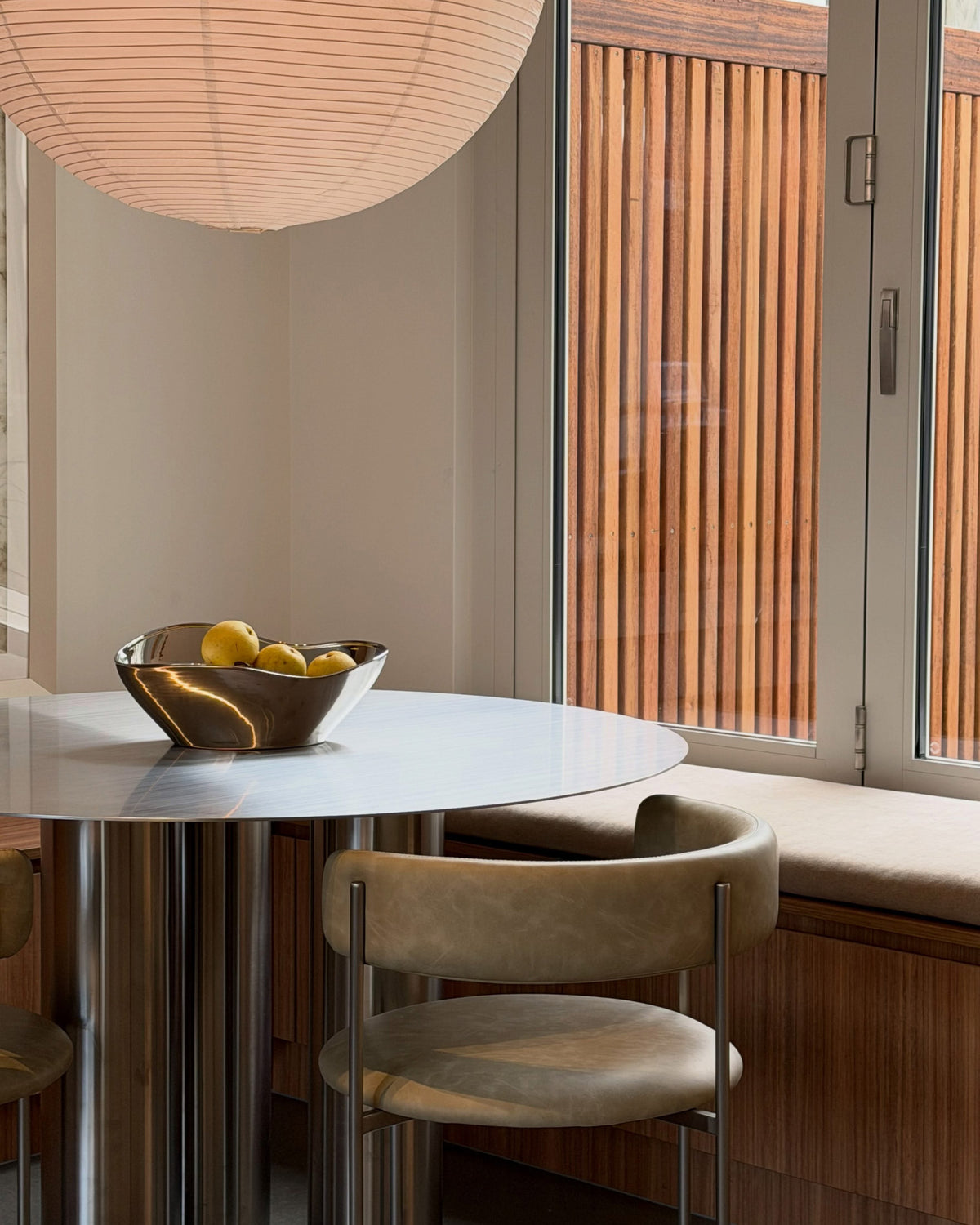 Stainless steel dining table styled in a dining room