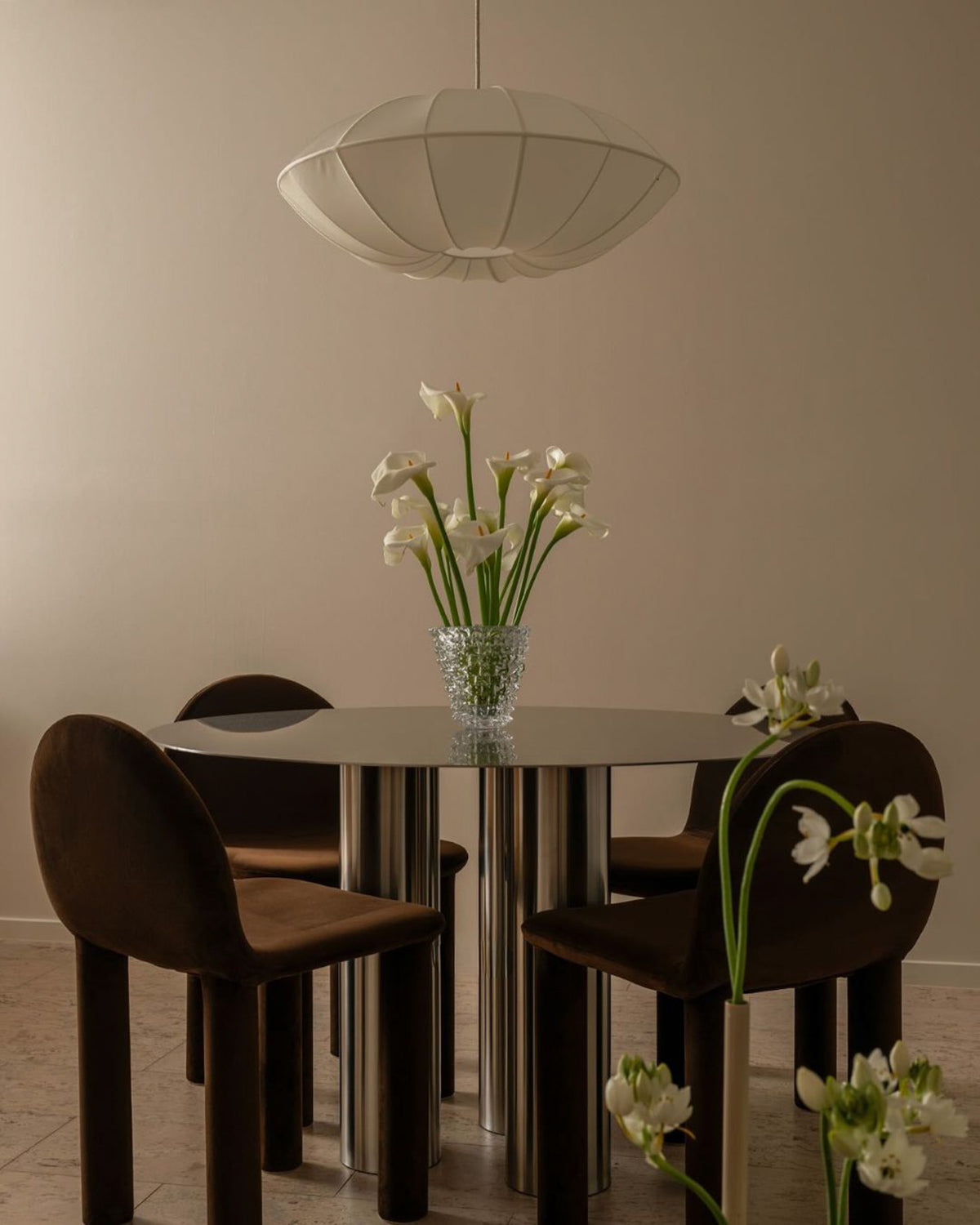 Modern dining room with a stainless steel dining table