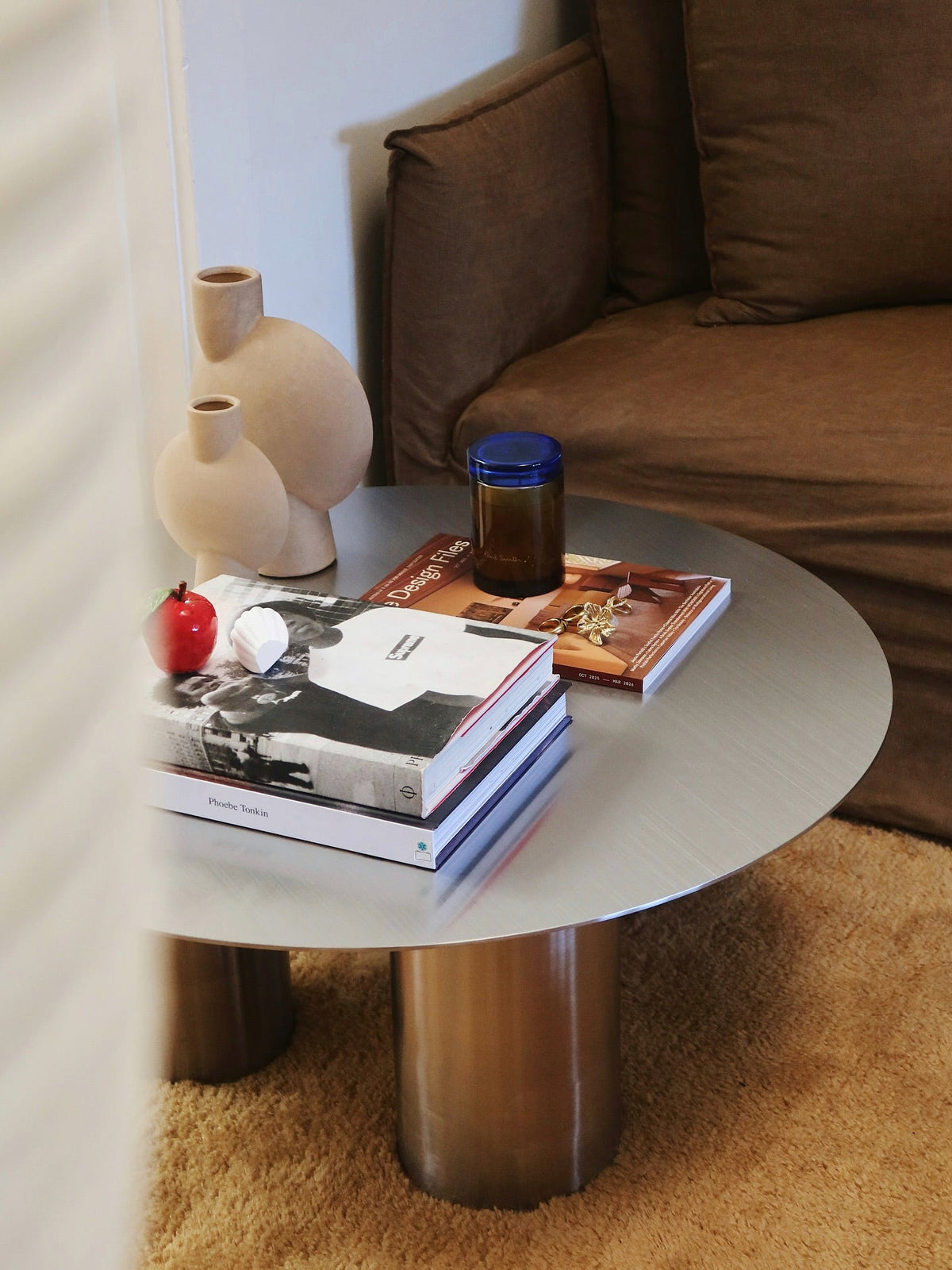 Round stainless steel coffee table styled