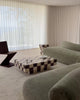 A modern checkered coffee table styled in a living room