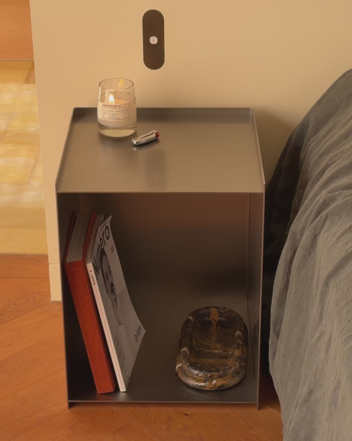 Stainless steel bedside table.