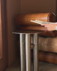 A stainless steel side table being styled